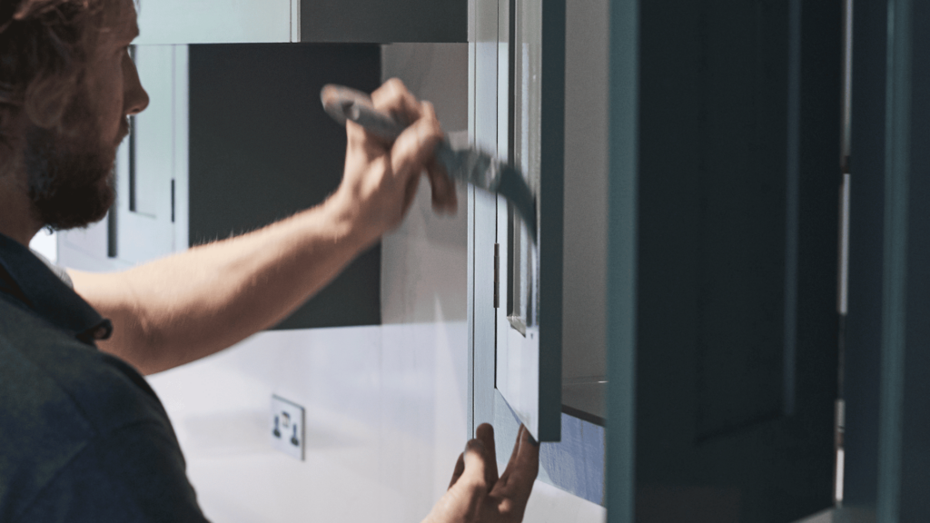 Hand-painting of kitchen cabinetry in situ