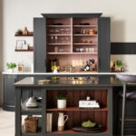 Black cabinetry in a monochrome kitchen setting